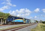 F40PH-3C # 811 pushes Tri-Rail Train # P668 away from the NW 28th Street grade crossing in Miami where I took this photo from